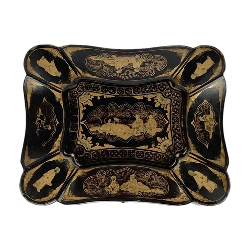 180 - A 19th century Chinese Export lacquer box. Of quatrefoil form decorated with figures within gardens,... 