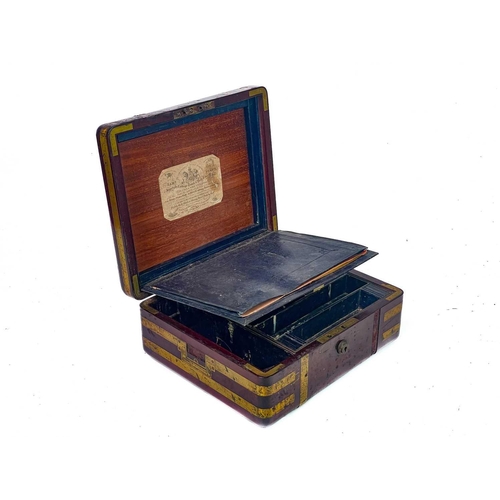 183 - A good William IV mahogany and brass bound campaign dressing case. The inside lid with a descriptive... 