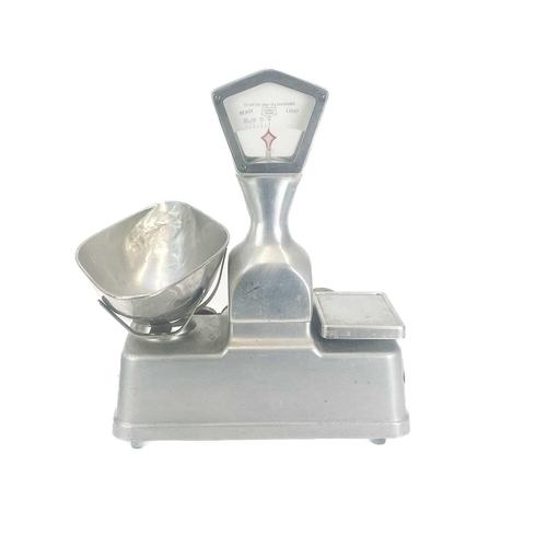 189 - A set of Vandome and Hart Ltd of London aluminium shop scales. With five weights. Height 46cm.