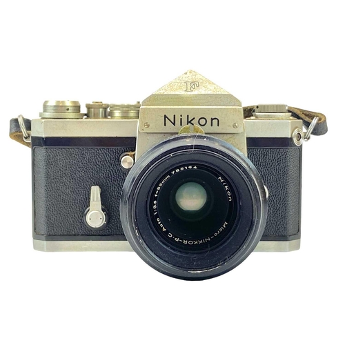 213 - A Nikon F SLR camera. Fitted with Nikon Micro Nikkor 55mm lens together with Nikon F Photomic finder... 