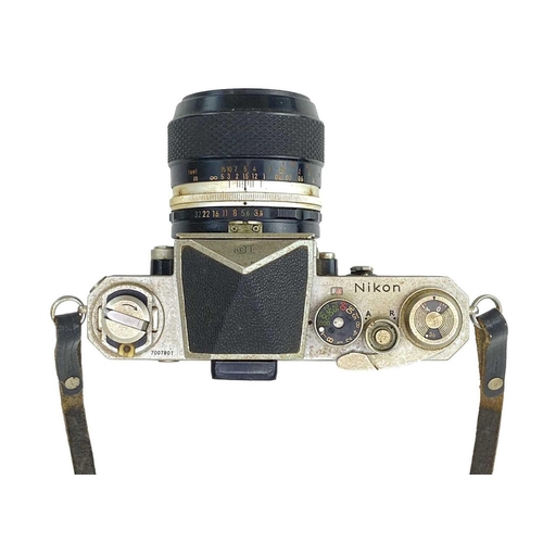 213 - A Nikon F SLR camera. Fitted with Nikon Micro Nikkor 55mm lens together with Nikon F Photomic finder... 