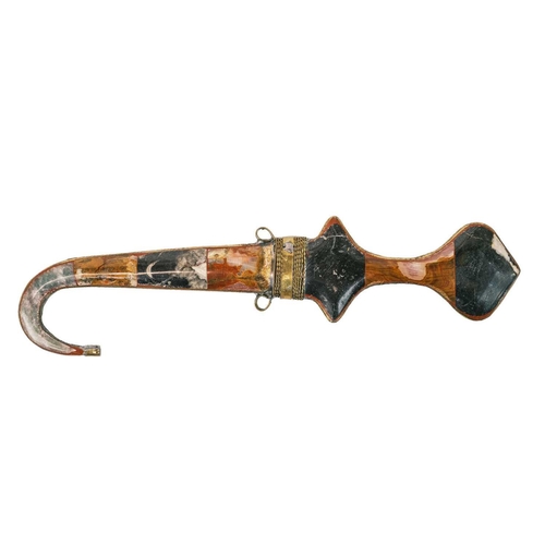 219 - A North African dagger. 20th century, with gilt filigree polished hardstone mounted sheath and hilt,... 