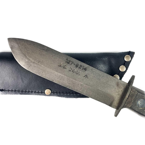 222 - A British military issue type-D survival knife. With blackened steel blade and ebonised grip, stampe... 