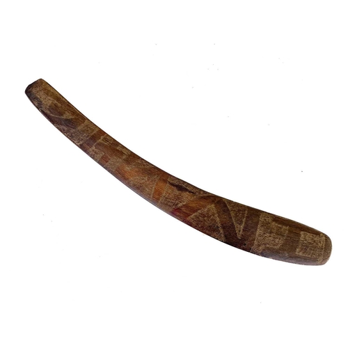 24 - A hardwood boomerang. One face with incised decoration, length 57cm.