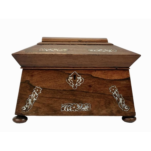 35 - An early Victorian rosewood and mother of pearl inlaid tea caddy. Of sarcophagus shape, on disc feet... 