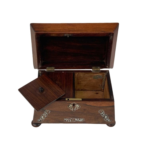 35 - An early Victorian rosewood and mother of pearl inlaid tea caddy. Of sarcophagus shape, on disc feet... 