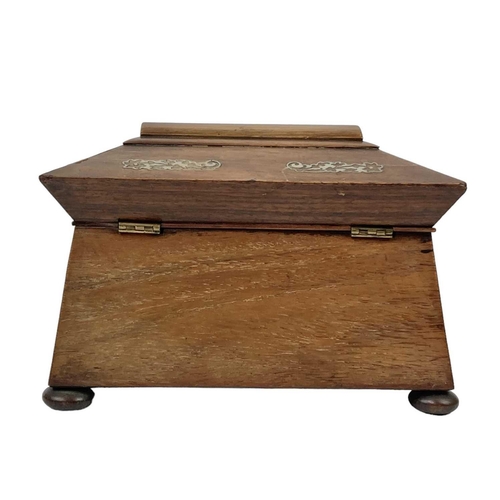 35 - An early Victorian rosewood and mother of pearl inlaid tea caddy. Of sarcophagus shape, on disc feet... 