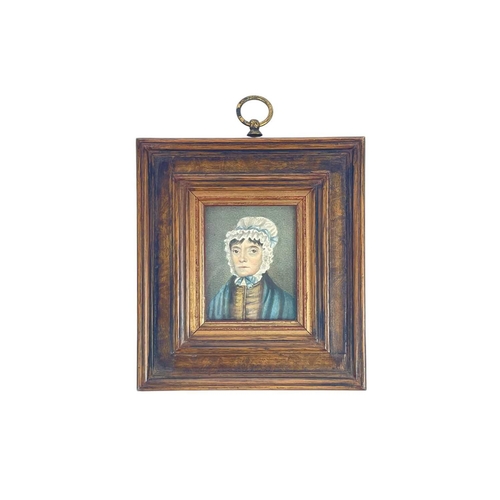 36 - A miniature portrait of a lady wearing a lace bonnet. Watercolour on paper, 6.5cm x 5.5cm together w... 