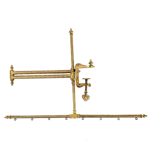 43 - A gilt metal tapestry adjustable frame with ornate clamp. Extended length 80cm.