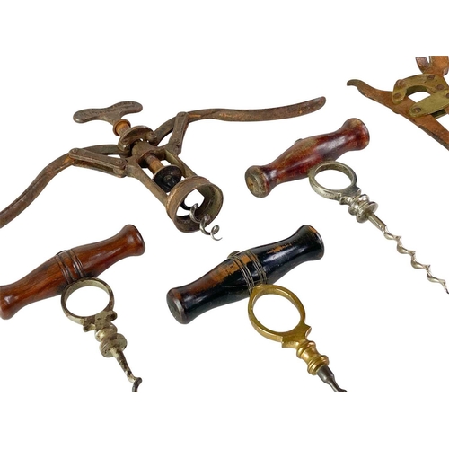 46 - A collection of signet type and lever type corkscrews. (7)