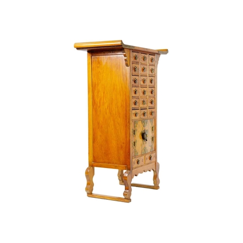 1 - A Chinese hardwood brass bound medicine cabinet, 20th century. With an arrangement of twenty drawers... 