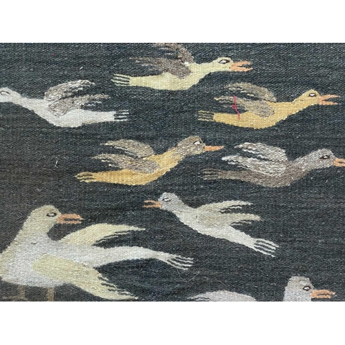 119 - A Bessarabian flatweave runner, early 20th century. The charcoal field with multiple rows of birds, ... 