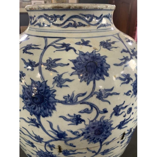 126 - A Chinese blue and white porcelain ovoid jar, Ming Dynasty. With all over scrolling lotus decoration... 