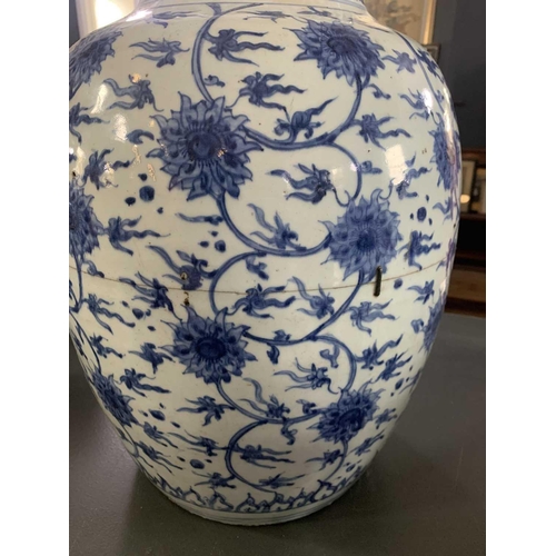 126 - A Chinese blue and white porcelain ovoid jar, Ming Dynasty. With all over scrolling lotus decoration... 