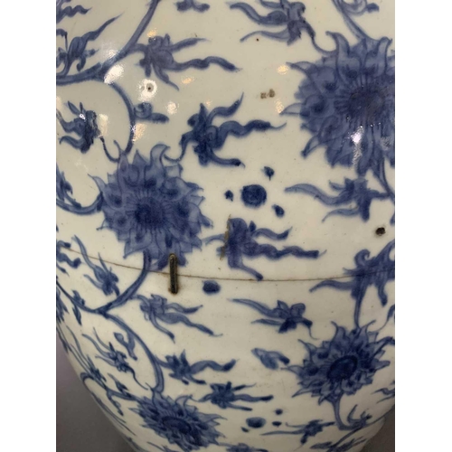 126 - A Chinese blue and white porcelain ovoid jar, Ming Dynasty. With all over scrolling lotus decoration... 