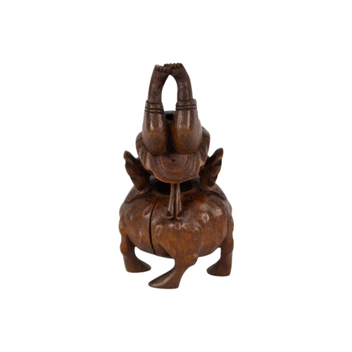 142 - A Chinese carved bamboo figure, late 19th/early 20th century. Depictung an acrobat on a large toad, ... 