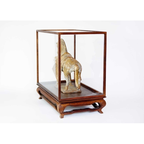 148 - A Chinese Tang style metal and pottery horse. In an early 20th century glazed and hardwood cabinet, ... 