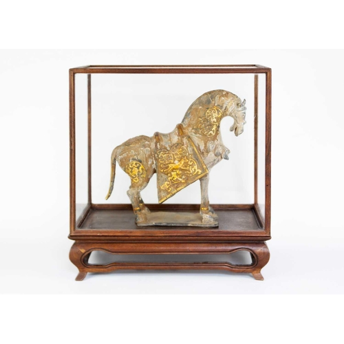 148 - A Chinese Tang style metal and pottery horse. In an early 20th century glazed and hardwood cabinet, ... 