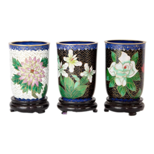 160 - Twelve Chinese cloisonne tumblers, 20th century. Each with black lacquered stands. (12)