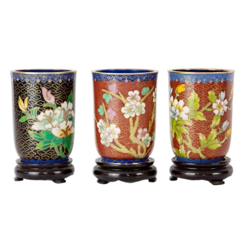 160 - Twelve Chinese cloisonne tumblers, 20th century. Each with black lacquered stands. (12)