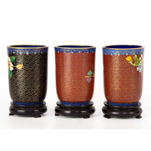 160 - Twelve Chinese cloisonne tumblers, 20th century. Each with black lacquered stands. (12)