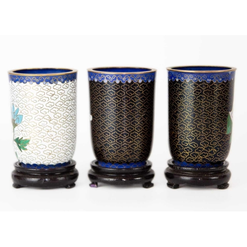 160 - Twelve Chinese cloisonne tumblers, 20th century. Each with black lacquered stands. (12)