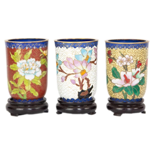 160 - Twelve Chinese cloisonne tumblers, 20th century. Each with black lacquered stands. (12)