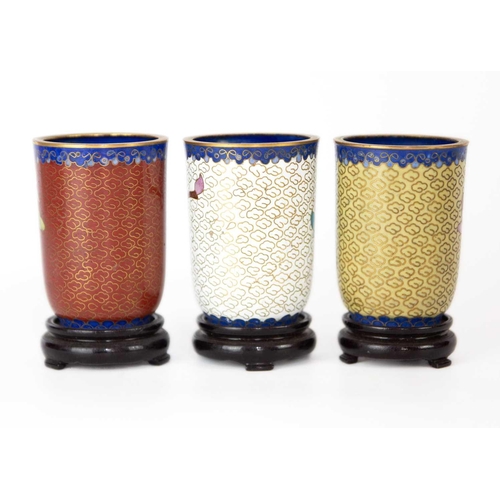 160 - Twelve Chinese cloisonne tumblers, 20th century. Each with black lacquered stands. (12)