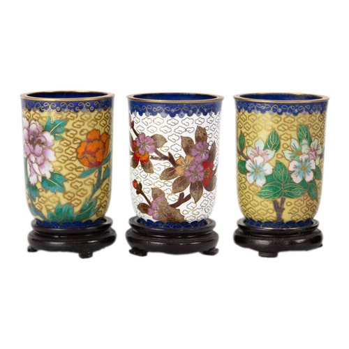 160 - Twelve Chinese cloisonne tumblers, 20th century. Each with black lacquered stands. (12)