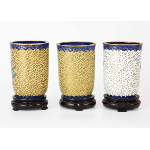 160 - Twelve Chinese cloisonne tumblers, 20th century. Each with black lacquered stands. (12)