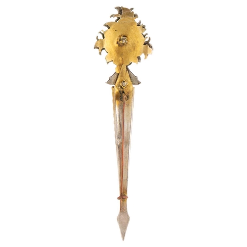 163 - An Indian gilt metal turban pin. With ruby and white paste, length 11cm, width 2.7cm.