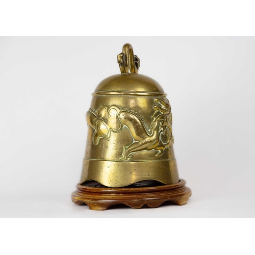 165 - A Chinese polished bronze bell, early 20th century. With a dragon chasing the flaming pearl, on a 20... 