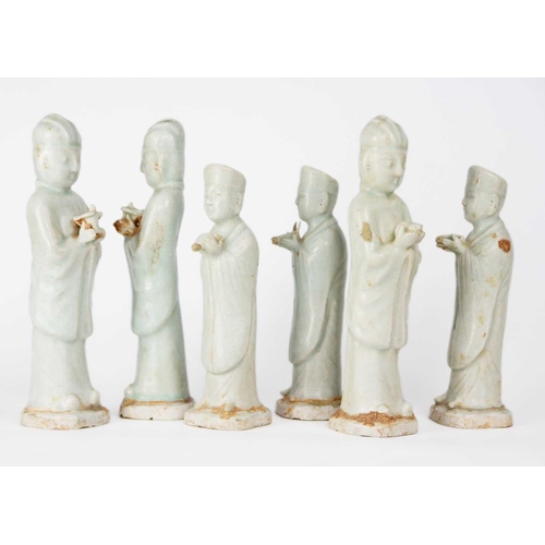 174 - Six Chinese celadon glazed pottery figures, probably Yuan Dynasty. Heights 26 and 22.5cm. (6)