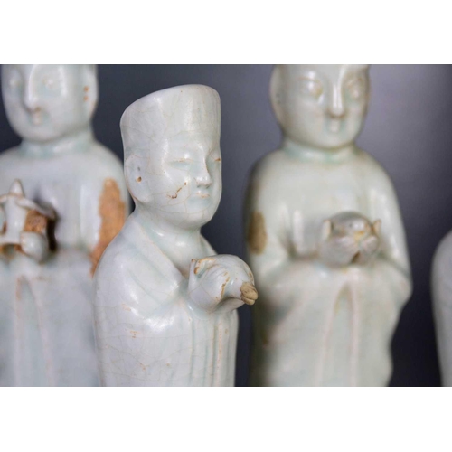 174 - Six Chinese celadon glazed pottery figures, probably Yuan Dynasty. Heights 26 and 22.5cm. (6)