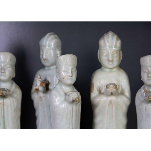 174 - Six Chinese celadon glazed pottery figures, probably Yuan Dynasty. Heights 26 and 22.5cm. (6)