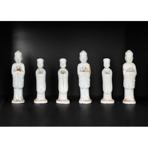 174 - Six Chinese celadon glazed pottery figures, probably Yuan Dynasty. Heights 26 and 22.5cm. (6)