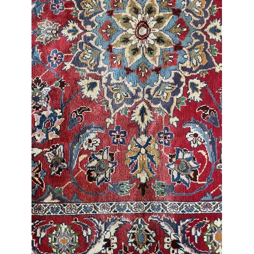 192 - A Mahal carpet, West Persia, mid 20th century. The madder field with a central lobed polychrome meda... 