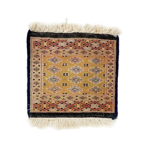 193 - A Pakistan rug, mid 20th century. The blue field with rows of multiple polychrome medallions, within... 