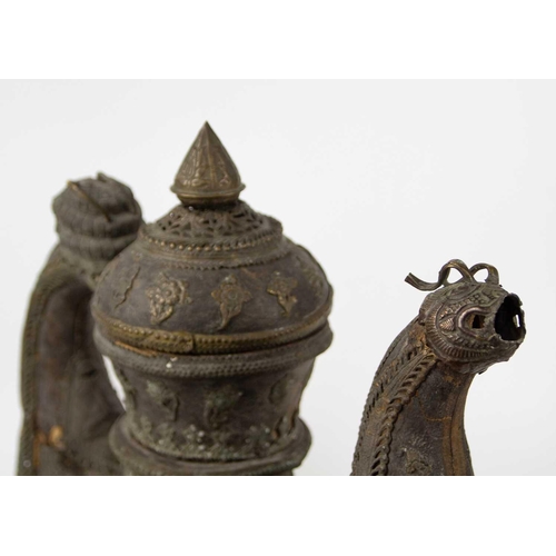 198 - A Chinese wooden ewer, Qing Dynasty. With brass mounts including opposing grotesque masks, height 47... 