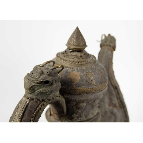 198 - A Chinese wooden ewer, Qing Dynasty. With brass mounts including opposing grotesque masks, height 47... 