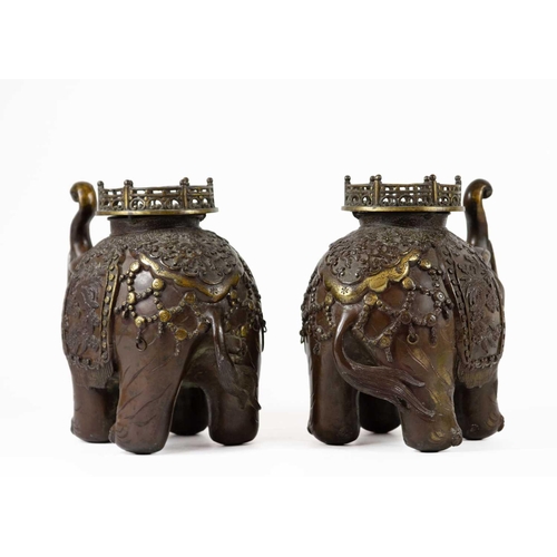 2 - A pair of Chinese bronze elephant incense burners. Early 20th century, height 21.5cm, width 24cm. (2... 