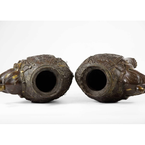 2 - A pair of Chinese bronze elephant incense burners. Early 20th century, height 21.5cm, width 24cm. (2... 