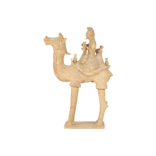 218 - A Chinese pottery model of a camel and rider, possibly Tang Dynasty. Made for the Persian market, he... 