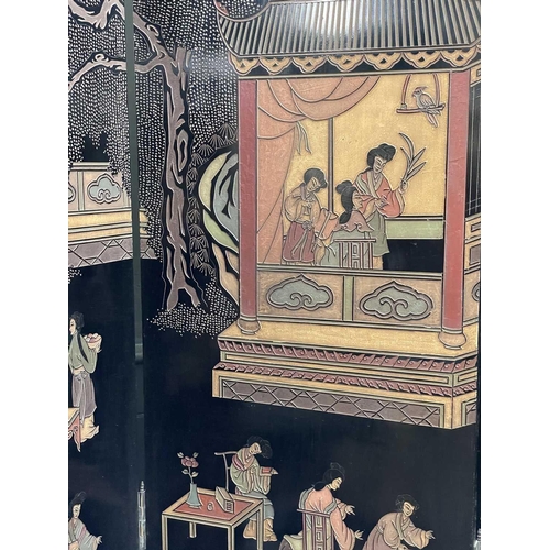 219 - A Chinese black lacquered screen, early 20th century. With eight panels, height 214cm.