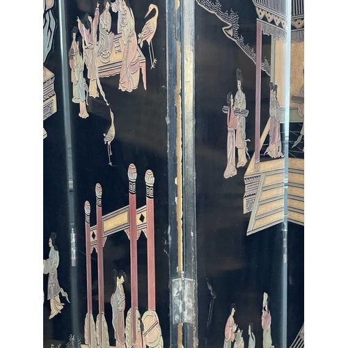 219 - A Chinese black lacquered screen, early 20th century. With eight panels, height 214cm.