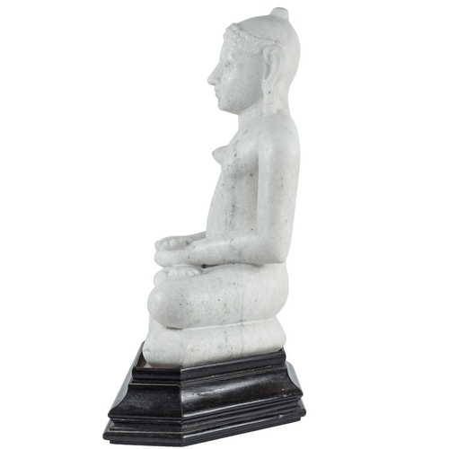 220 - An Indian Jain carved white marble figure of Jina, 19th century. Seated in double lotus on a cushion... 