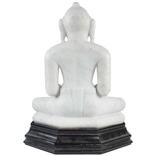 220 - An Indian Jain carved white marble figure of Jina, 19th century. Seated in double lotus on a cushion... 