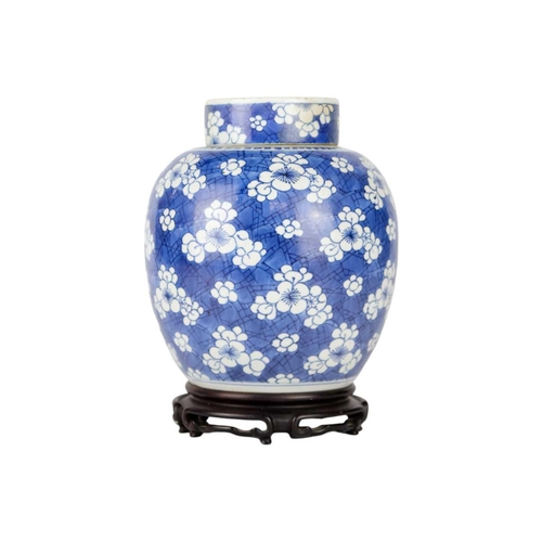 235 - A Chinese porcelain prunus pattern ginger jar and cover, 19th century. On a wooden stand, height 24c... 