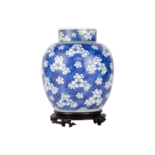 235 - A Chinese porcelain prunus pattern ginger jar and cover, 19th century. On a wooden stand, height 24c... 