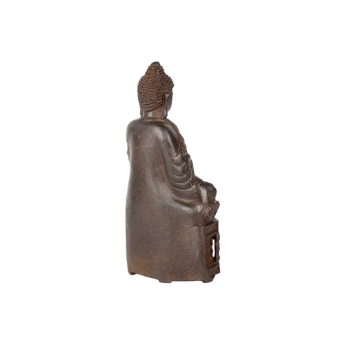 246 - A Chinese iron model of Buddha, 19th century. The Buddha seated on a plinth, inscriptions to rear, h... 